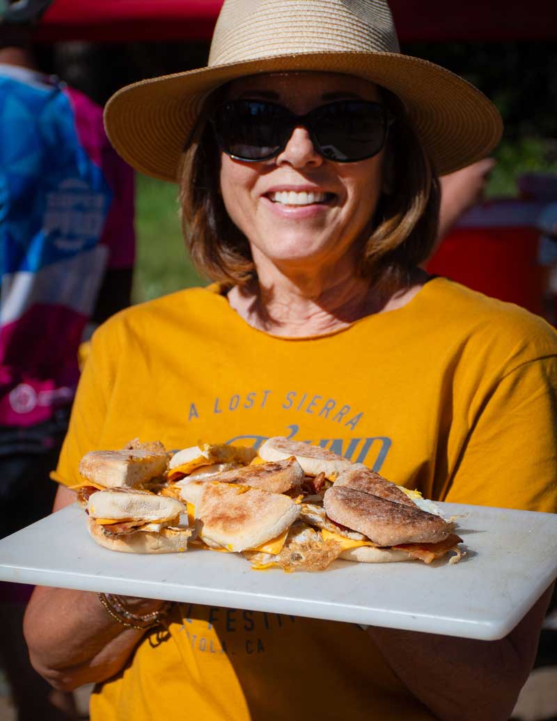 Aid station worker with breakfast sandwiches