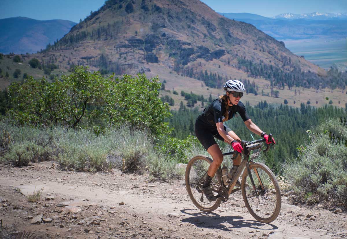 Female rider with mountains in background